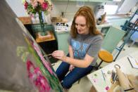 Student painting flowers